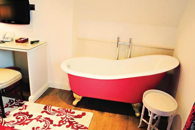 Bath tub in a room at The Wheatley Arms